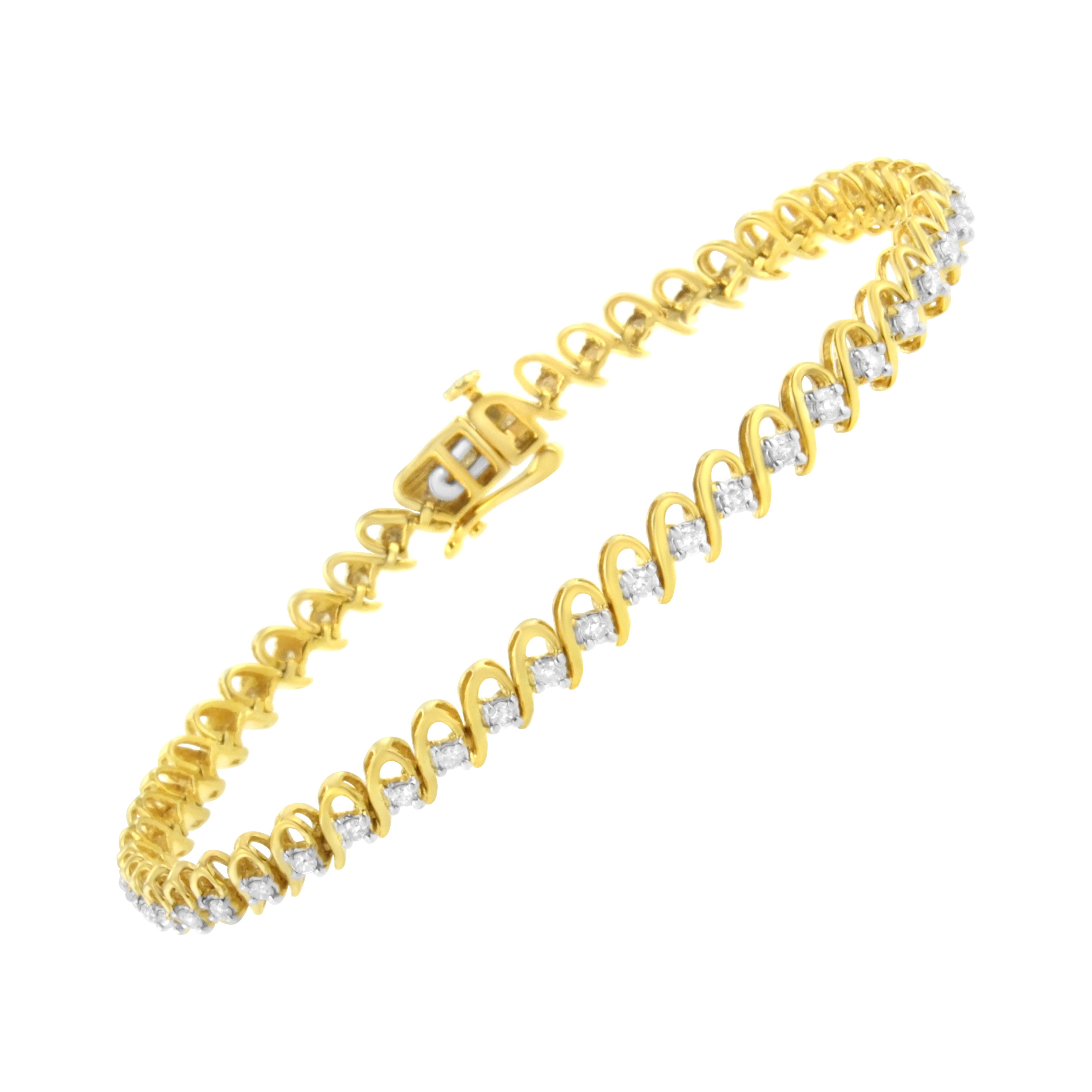 This unique bracelet is crafted with 1ct TDW of round cut diamonds nestled between a warm yellow gold ribbon that creates a spiral effect. This 10k yellow gold plated sterling silver design is a great statement piece that secures with a box with