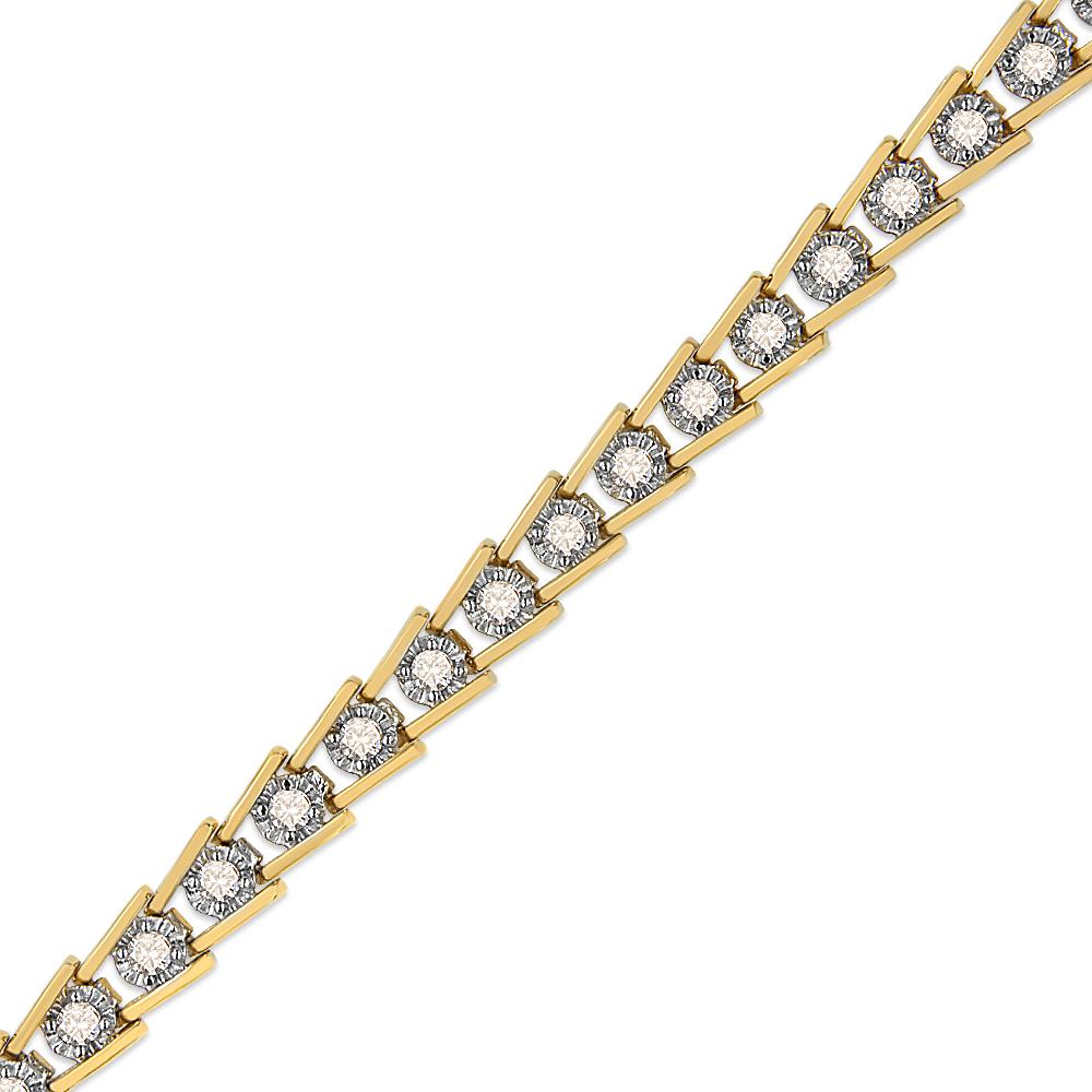 Gold top and bottom links frame single, round-cut diamonds to create this magnificent wave-like design on this 2 carat bracelet. Round-cut diamonds in a classic miracle setting are embellished in the finest 14k yellow gold plated .925 sterling
