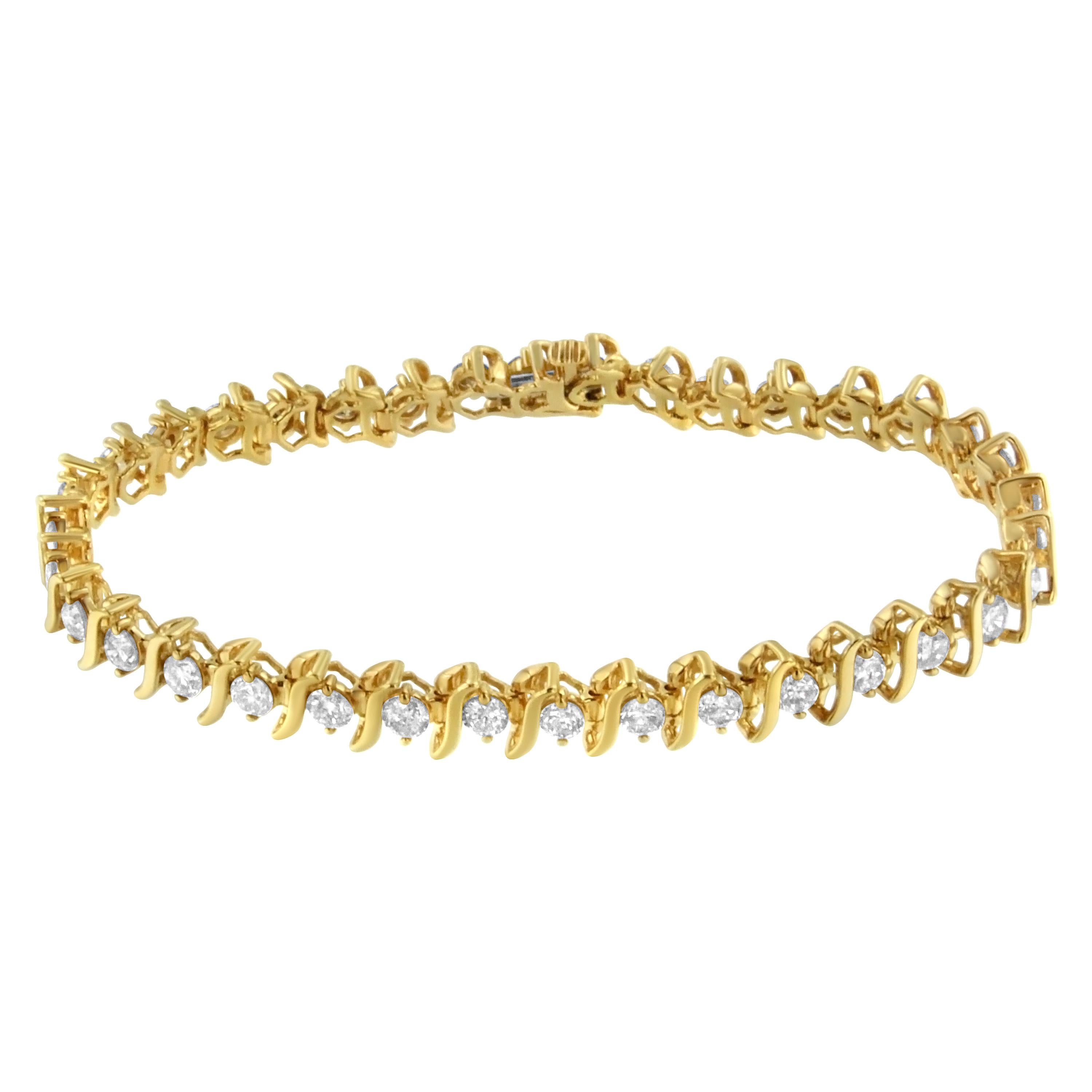 A stunning link bracelet that glistens with round diamonds set within S-shape links to add a timeless touch to this design. Crafted in 2 micron 14 karat yellow gold plated sterling silver, this bracelet elegantly puts the finishing touch on an