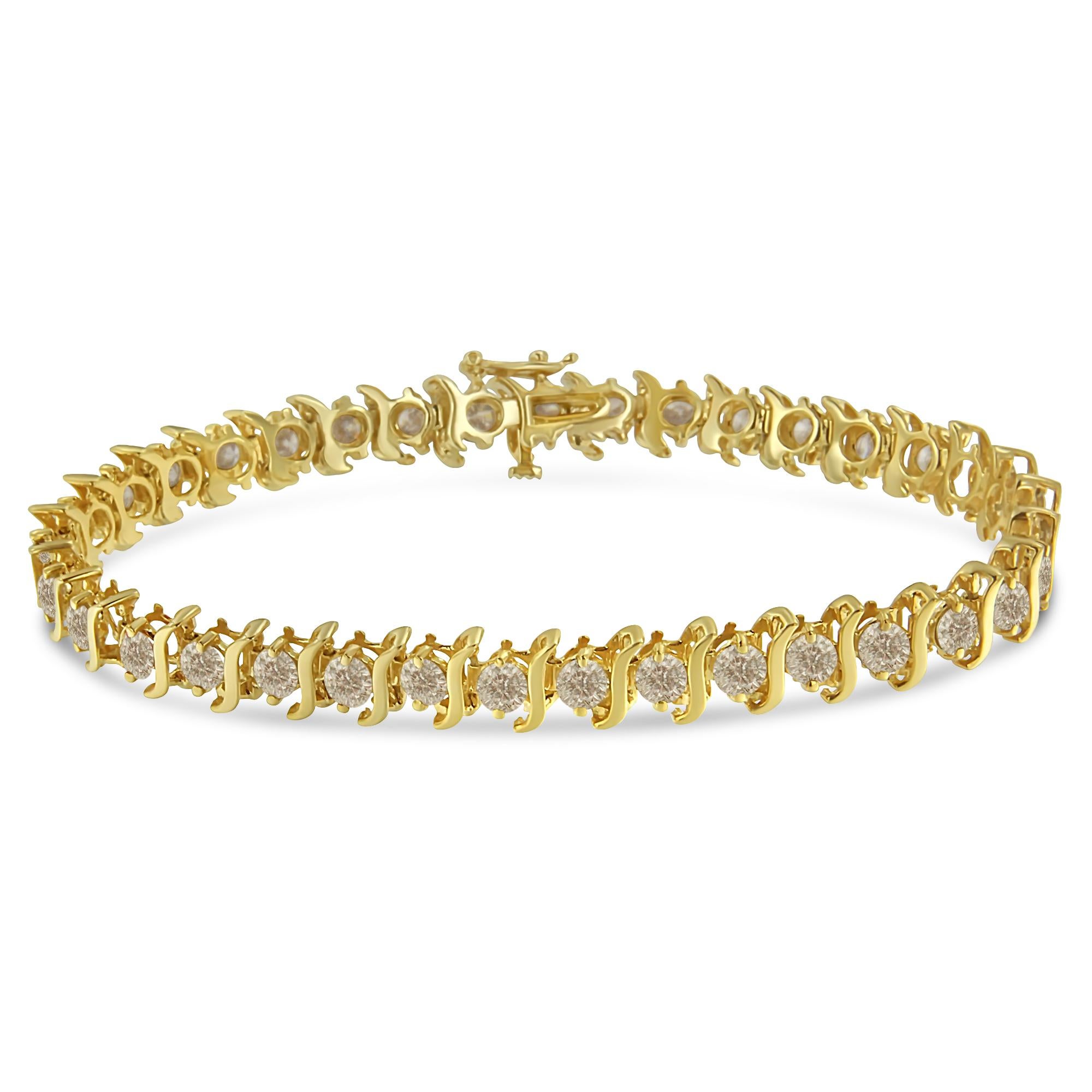 Elegantly crafted from 10kt yellow gold plated .925 sterling silver, this shimmering tennis bracelet has a dazzling design, rife with 7 carats of sparkling round brilliant-cut white diamonds. The brilliant bracelet features an alternating pattern of