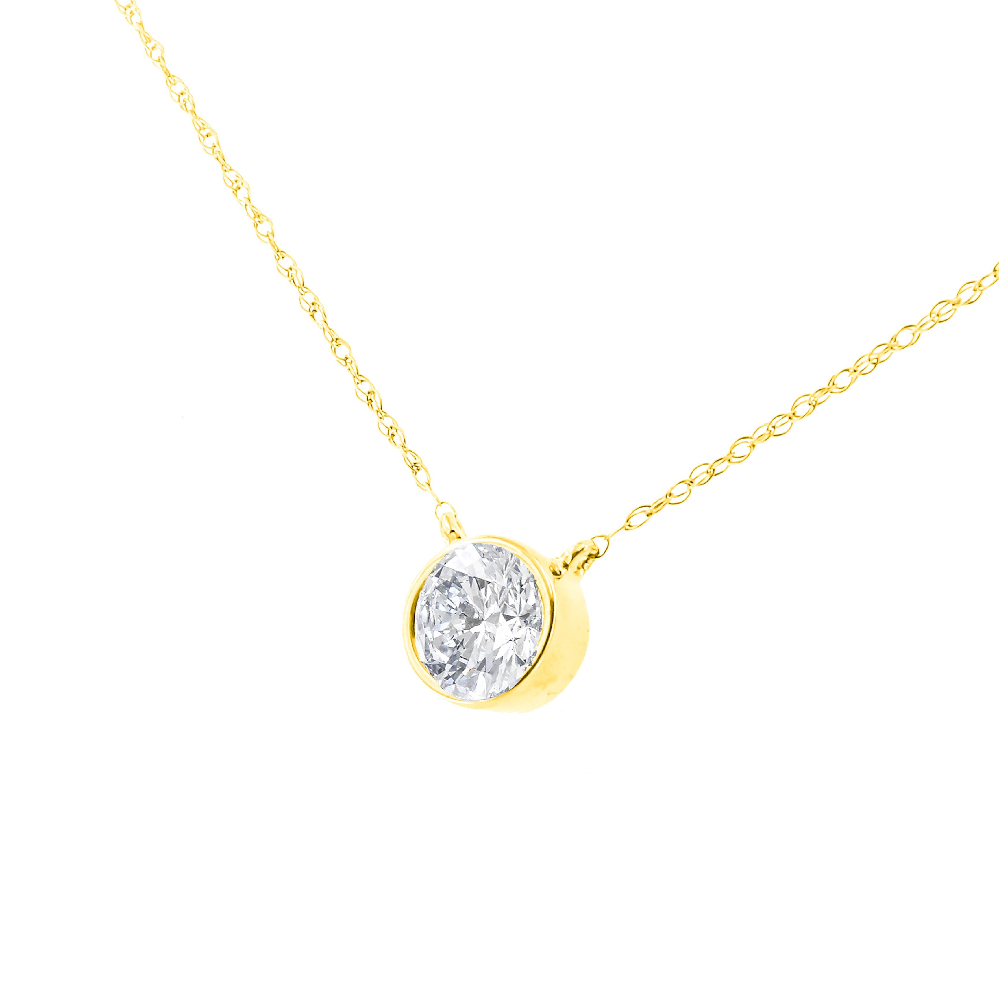 Wear this classic solitaire necklace to add a touch of elegance to your day. A glittering 1ct TDW round cut diamond is encircled in a bezel setting and anchored in the center of a delicate cable chain. This gorgeous pendant is crafted in 14k yellow