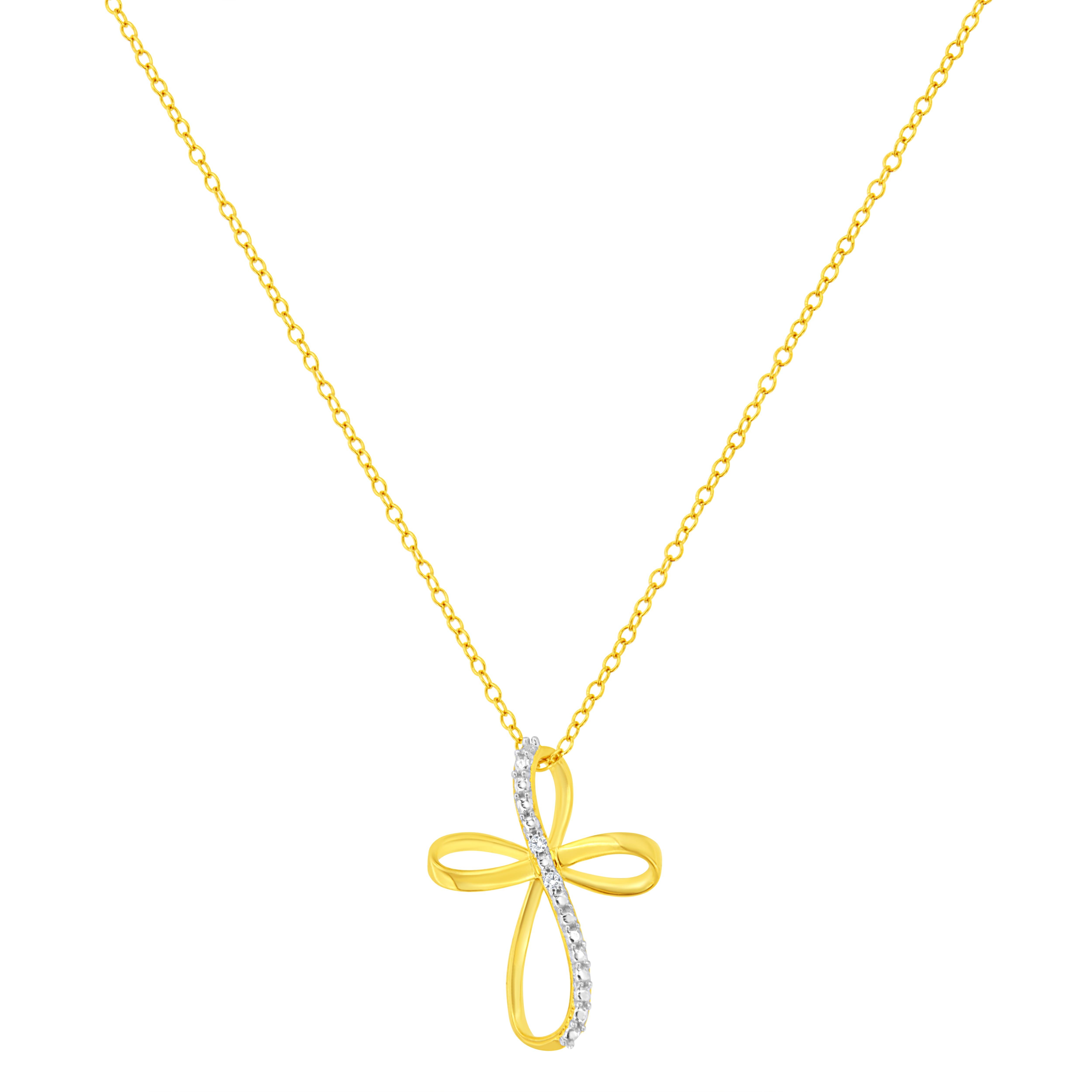 Show off your faith with this stunning 10K yellow gold coated .925 sterling silver ribbon cross pendant. The cross shaped pendant crafted with warm weaves of 10k yellow gold flashed sterling and is accented with 2 natural, round, diamonds, .The