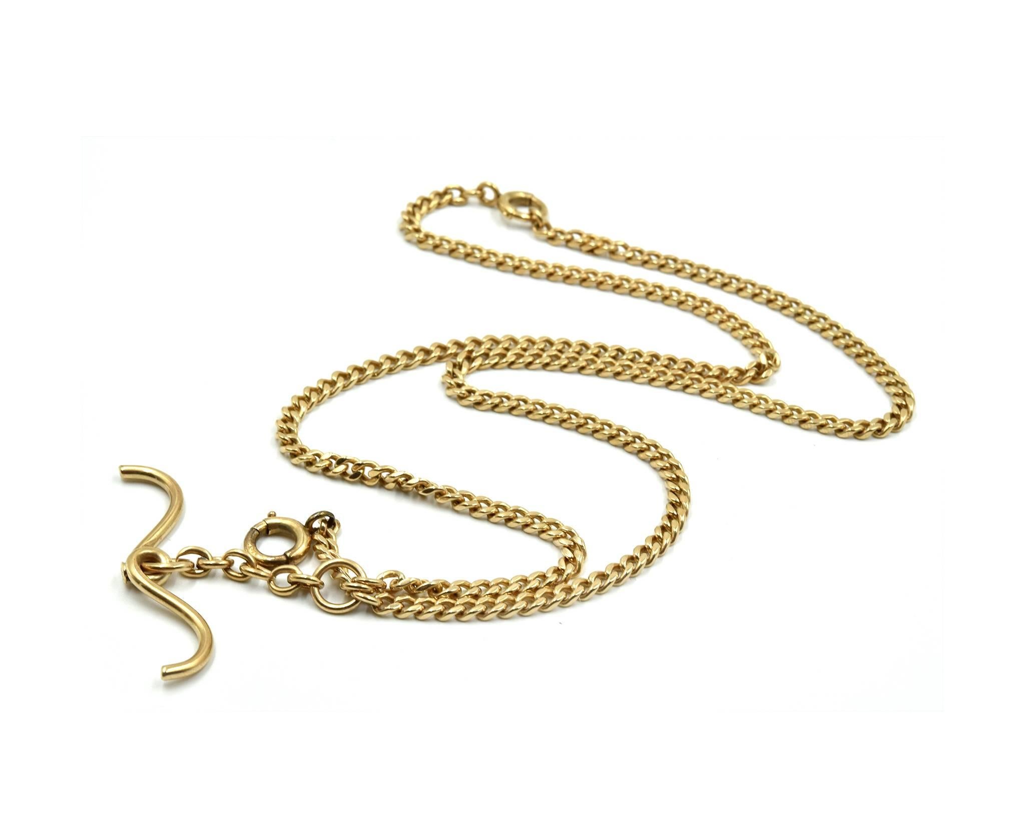 Designer: custom design
Material: 14k yellow gold
Dimensions: chain measures 22-inches long
Weight: 28.93 grams
