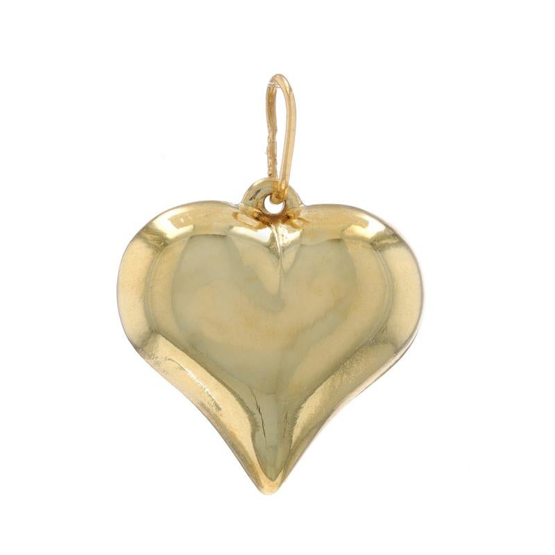 Metal Content: 14k Yellow Gold

Theme: Puffy Heart, Love
Features: Hollow Construction for Comfortable, All Day Wear

Measurements

Tall (from stationary bail): 5/8