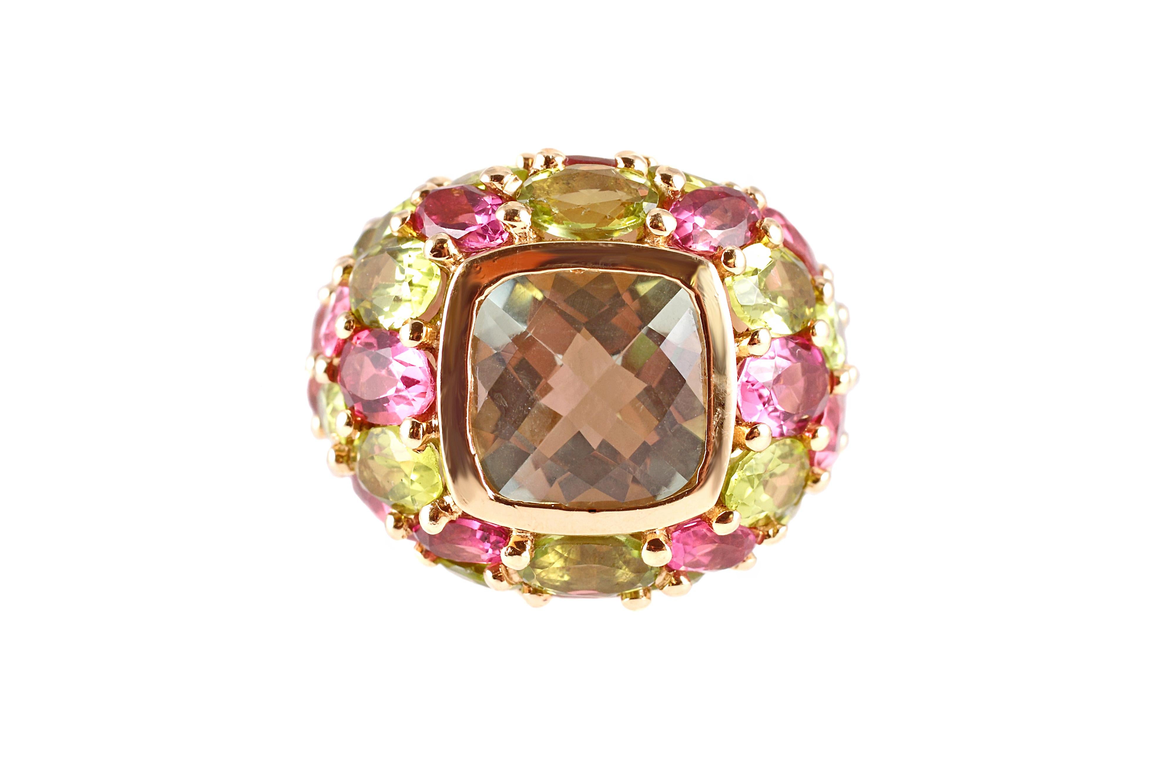 In a size 7 1/2 - this charming ring is in 14 karat yellow gold and features popping quartz, tourmaline and peridot stones. 
