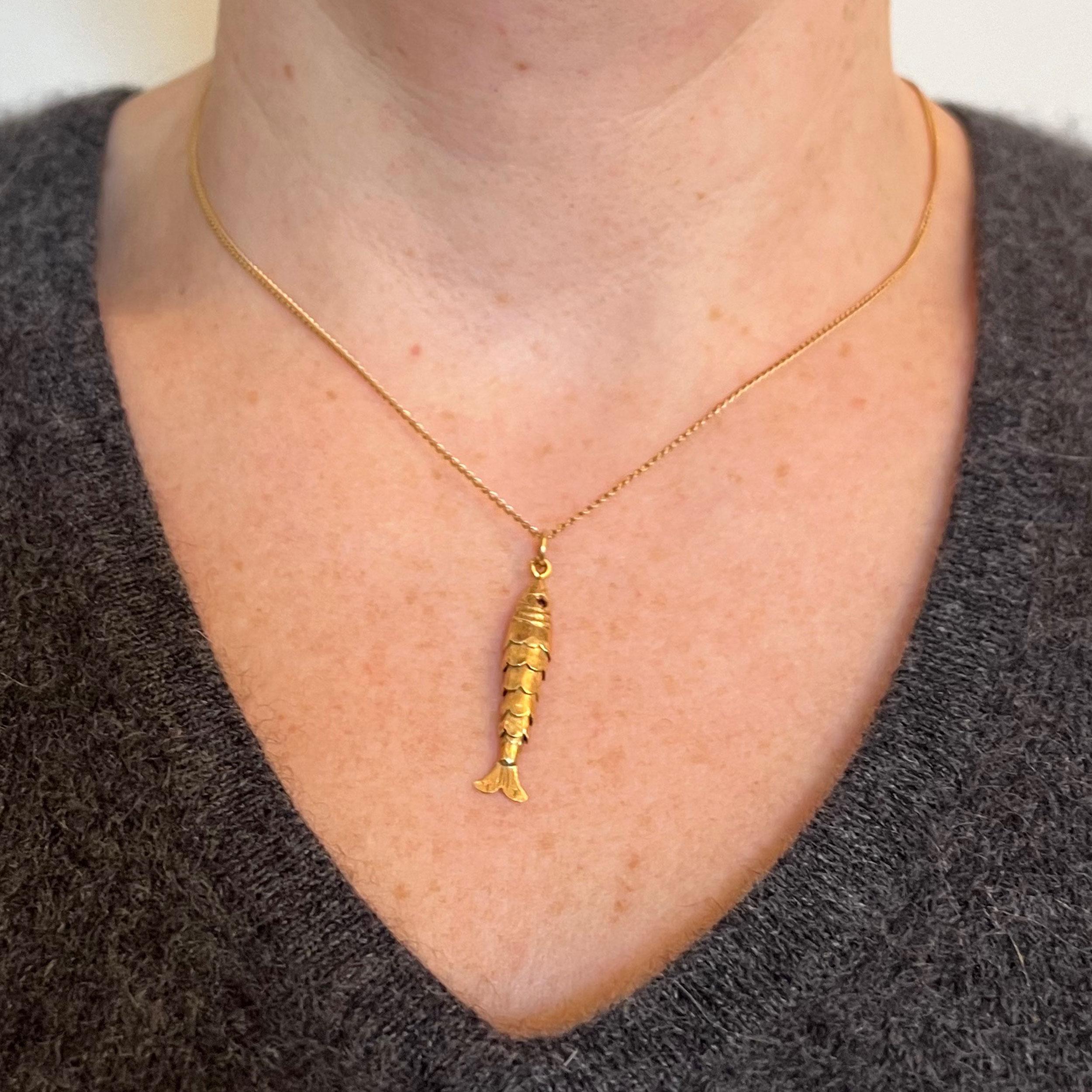 gold articulated fish pendant