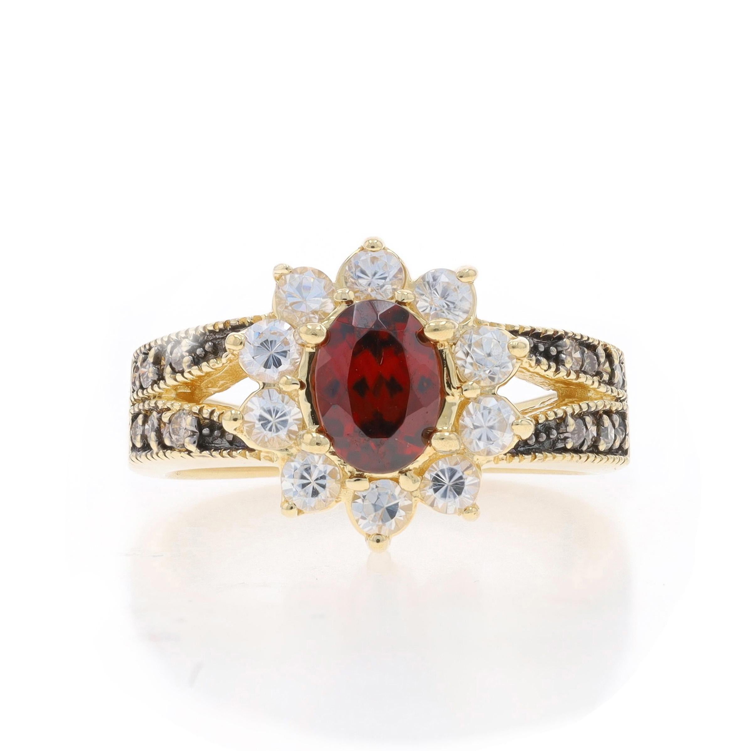 Size: 7
Sizing Fee: Up 2 sizes for $40 or Down 1 size for $40

Metal Content: 14k Yellow Gold

Stone Information
Natural Zircon
Carat(s): 1.45ct
Cut: Oval
Color: Red

Natural Zircons
Carat(s): 1.10ctw
Cut: Round
Color: White

Natural