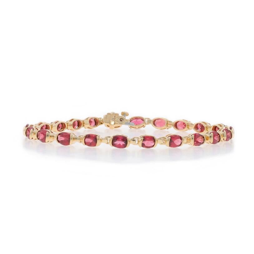 Metal Content: 14k Yellow Gold

Stone Information

Natural Rhodolite Garnets
Carat(s): 9.02ctw
Cut: Oval
Color: Purplish Red

Total Carats: 9.02ctw

Style: Tennis
Fastening Type: Tongue Box Clasp with Fold-Under Safety Clasp

Measurements

Length: 7
