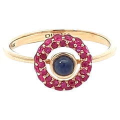 Bague en or jaune 14 carats avec saphir bleu cabochon et rubis rond