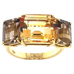 Yellow Gold Ring Surmounted by a Citrine Center Stone and 2 Smoky Quartz