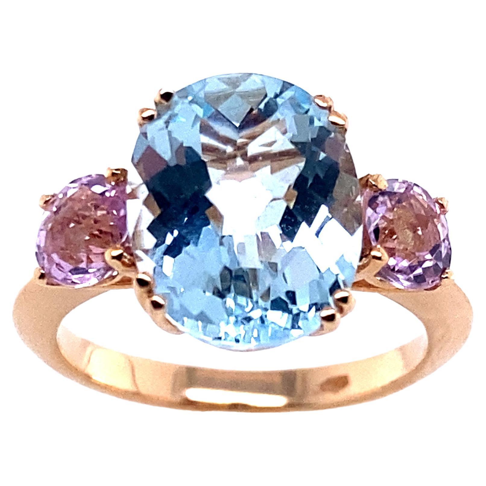 Yellow Gold Ring Surmounted by an Oval Topaz Accompanied by Two Kunzites For Sale