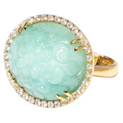 Yellow gold ring with diamonds and Flower carved emerald