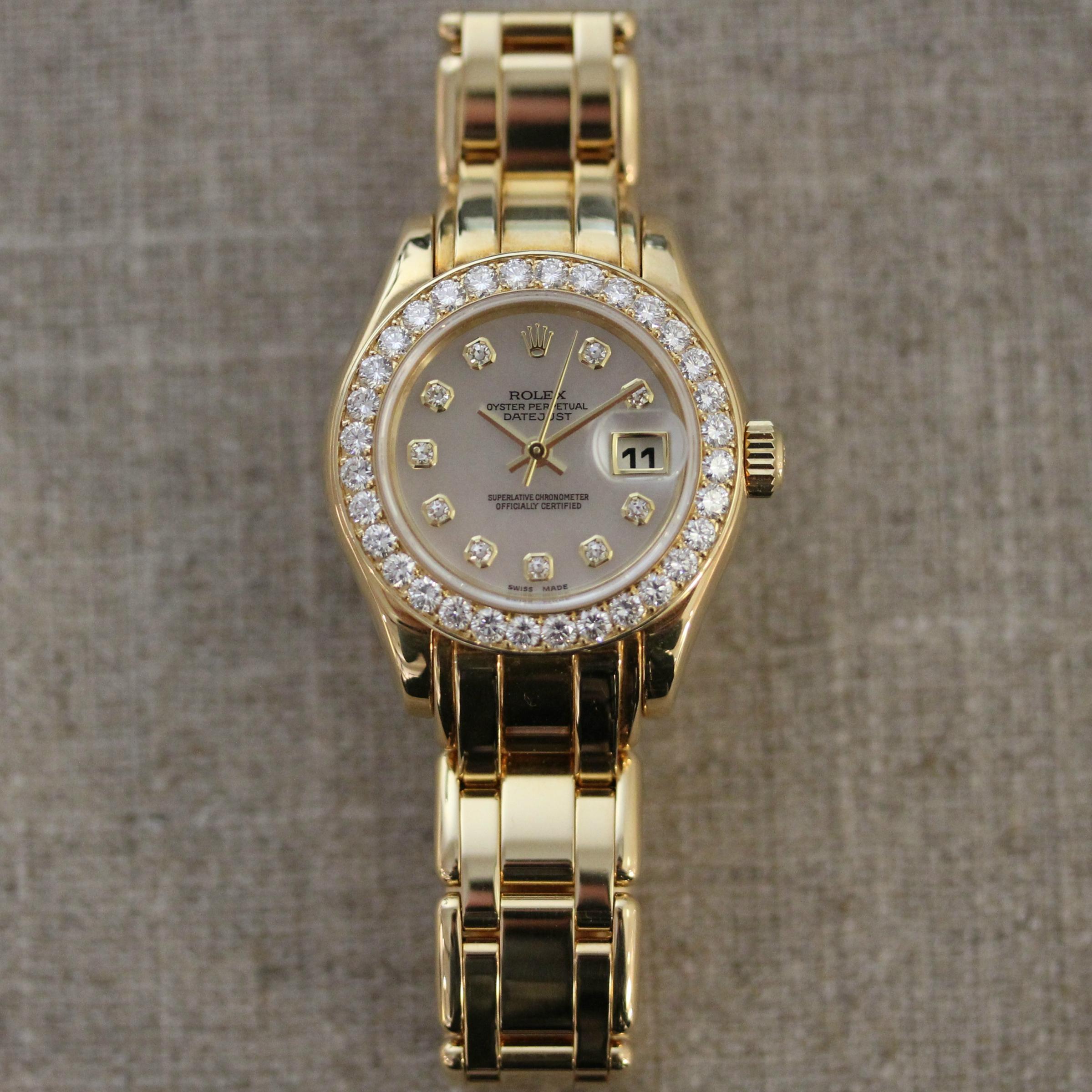 Vintage 18k yellow gold Rolex Pearlmaster Mother of Pearl diamond dial with
diamond bezel. The watch has a date at 3 position with a cyclops lens.
Model#69298 Circa 1995 No box or papers, recently serviced  by Hamilton Jewelers. Warranty provided 