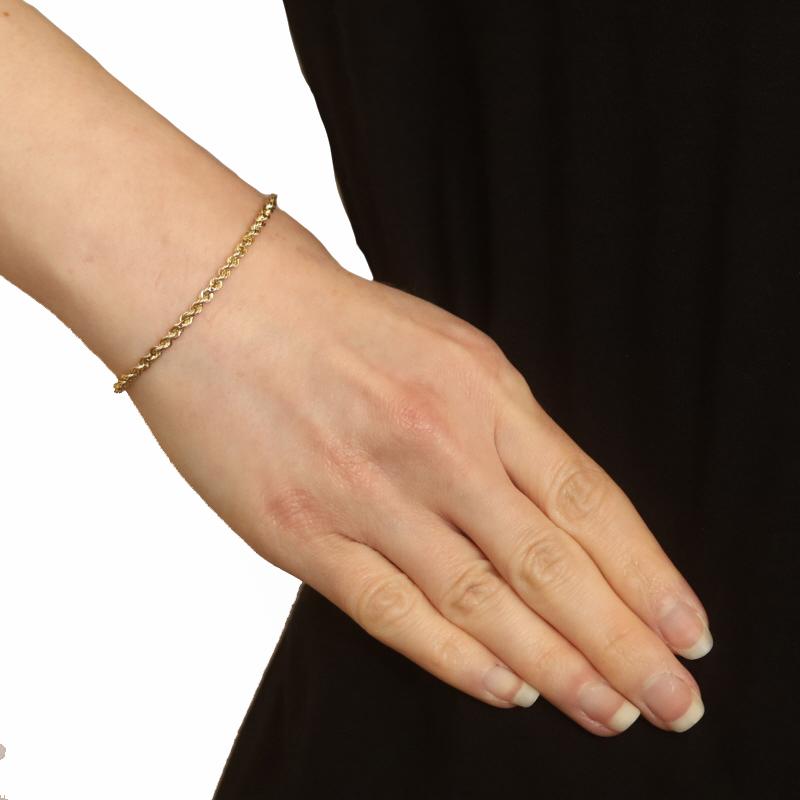 Metal Content: 14k Yellow Gold

Chain Style: Rope
Bracelet Style: Chain
Fastening Type: Tube Box Clasp with Side Safety Clasp

Measurements
Length: 7 3/4