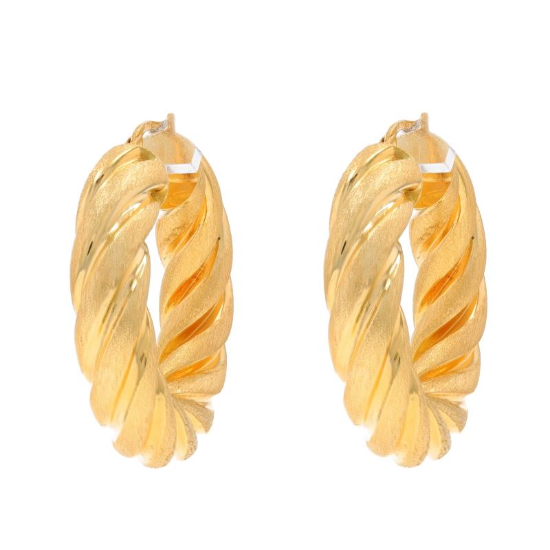 Metal Content: 14k Yellow Gold

Style: Hoop
Fastening Type: Snap Closures
Theme: Rope, Nautical Twist
Features: Smooth & textured finishes with a hollow construction for comfortable, all-day wear

Measurements
Tall: 1 15/32