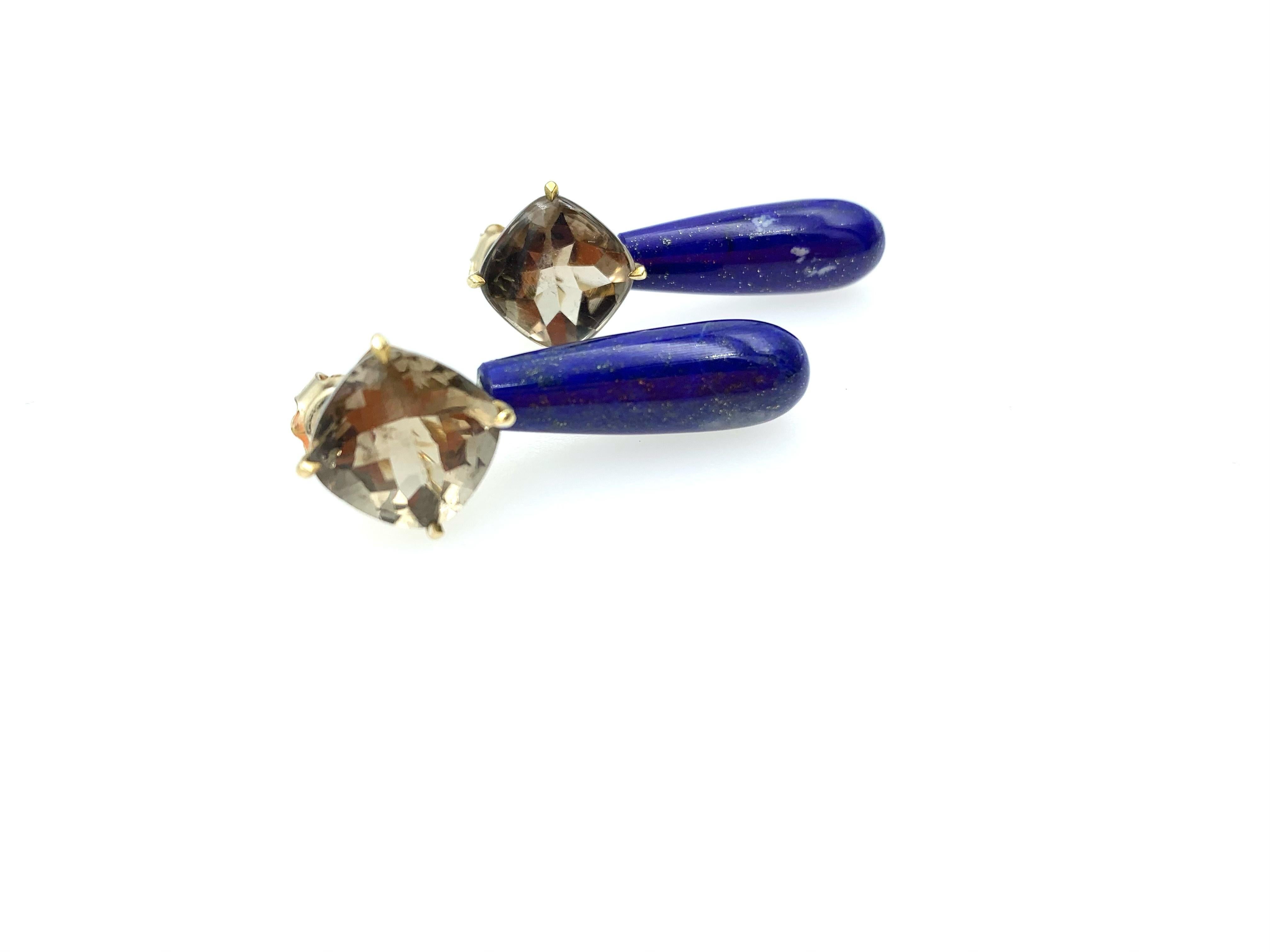 Hand made in 9 karat yellow gold with two Smokey Quartz, one square buff top and the other square rose cut. Both stones are 1 x 1 cms. The Lapis Lazuli smooth brioletts have a beautiful gold speckled shine to them with a length of 2.5 cms long. The