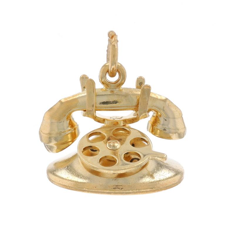 Contenido de metal: Oro amarillo de 14 quilates

Tema: Rotary Phone, Amor
Características: La Rueda se Mueve para Revelar el Mensaje 