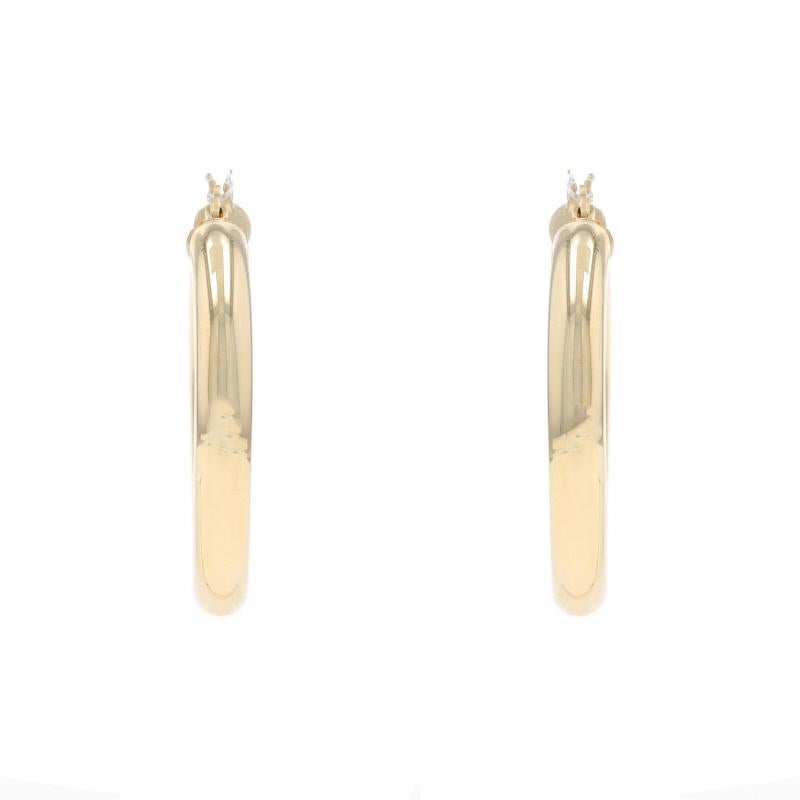 Metal Content: 14k Yellow Gold

Style: Hoop
Fastening Type: Snap Closures
Features: Hollow construction for comfortable, all-day wear

Measurements

Tall: 1 15/32