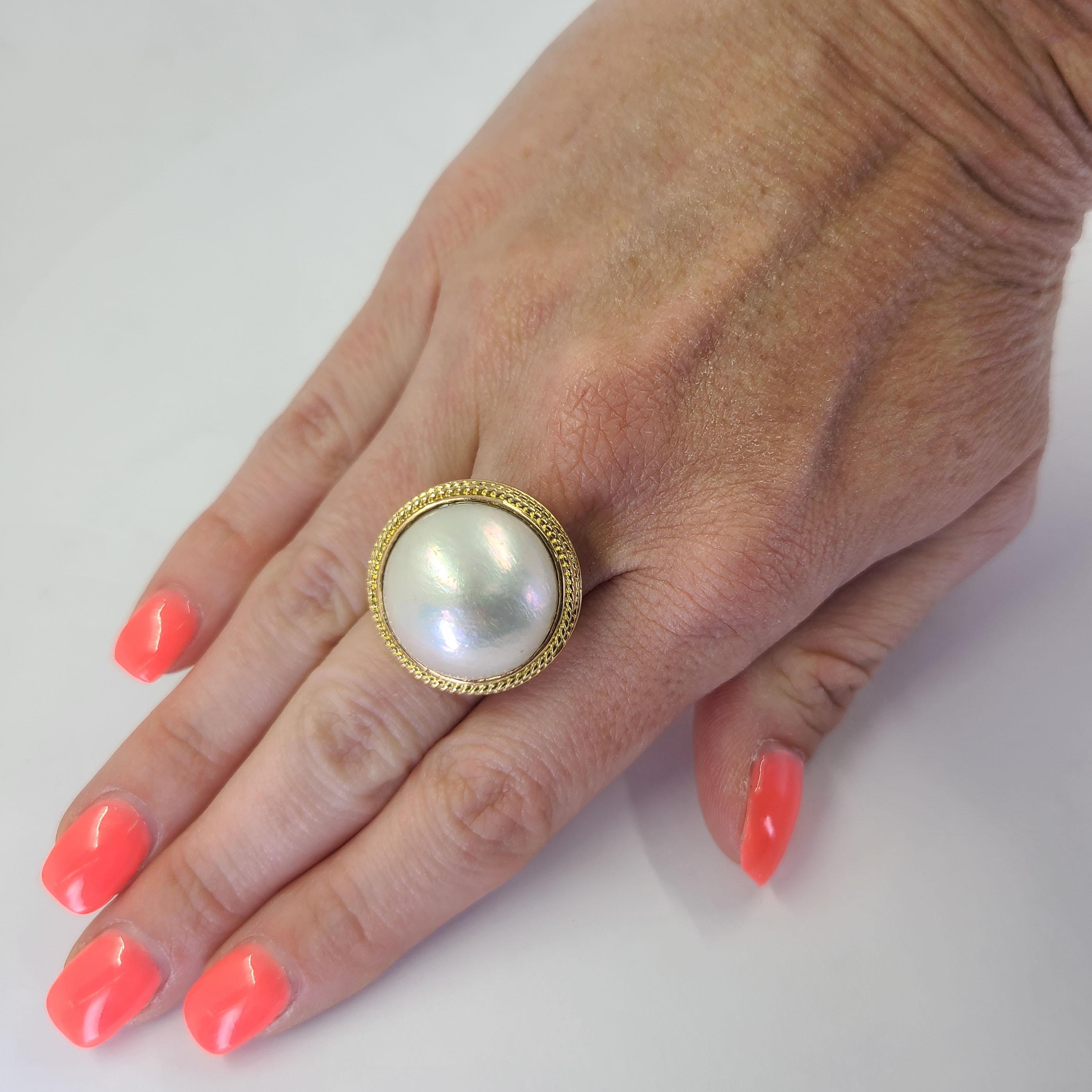 18 Karat Yellow Gold Round Mabe Pearl Ring With 0.92 Inch Diameter Including Bezel. Finger Size 5.5; Purchase Includes One Sizing Service Prior To Shipment. Finished Weight Is 13.7 Grams.