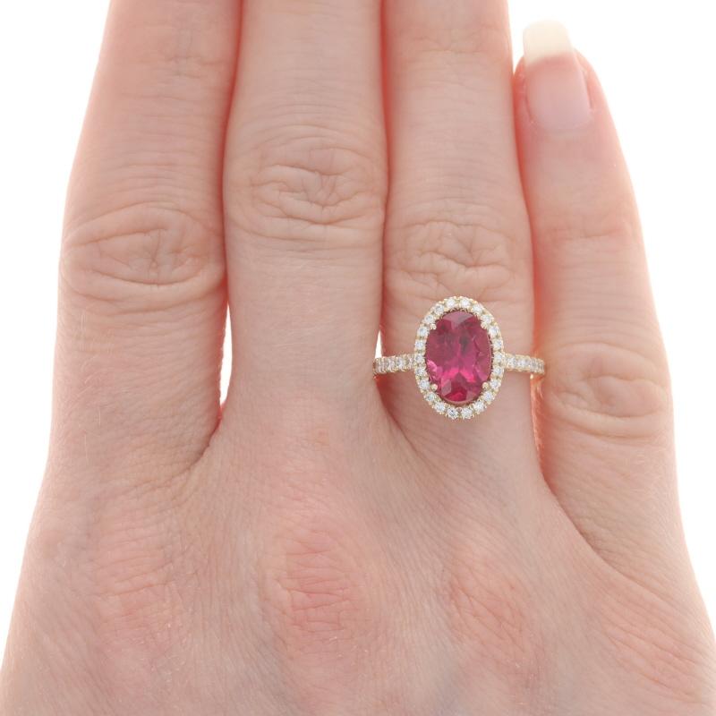 Size: 6 1/2
Sizing Fee: Up 2 sizes for $35 or Down 1 size for $35

Metal Content: 14k Yellow Gold

Stone Information
Natural Rubellite Tourmaline
Carat(s): 2.12ct
Cut: Oval
Color: Pink

Natural Diamonds
Carat(s): .37ctw
Cut: Round Brilliant
Color: G
