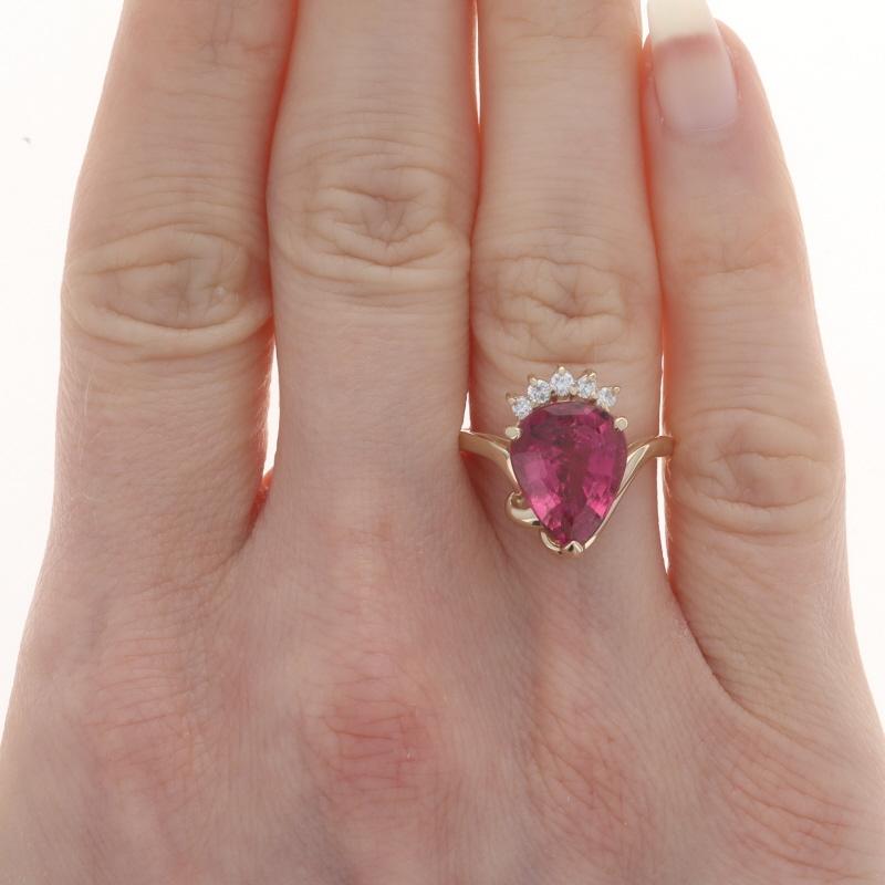 Size: 7
Sizing Fee: Up 2 sizes for $40 or Down 2 sizes for $40

Metal Content: 14k Yellow Gold

Stone Information

Natural Rubellite Tourmaline
Carat(s): 6.04ct
Cut: Pear Step
Color: Pink

Natural Diamonds
Carat(s): .12ctw
Cut: Round