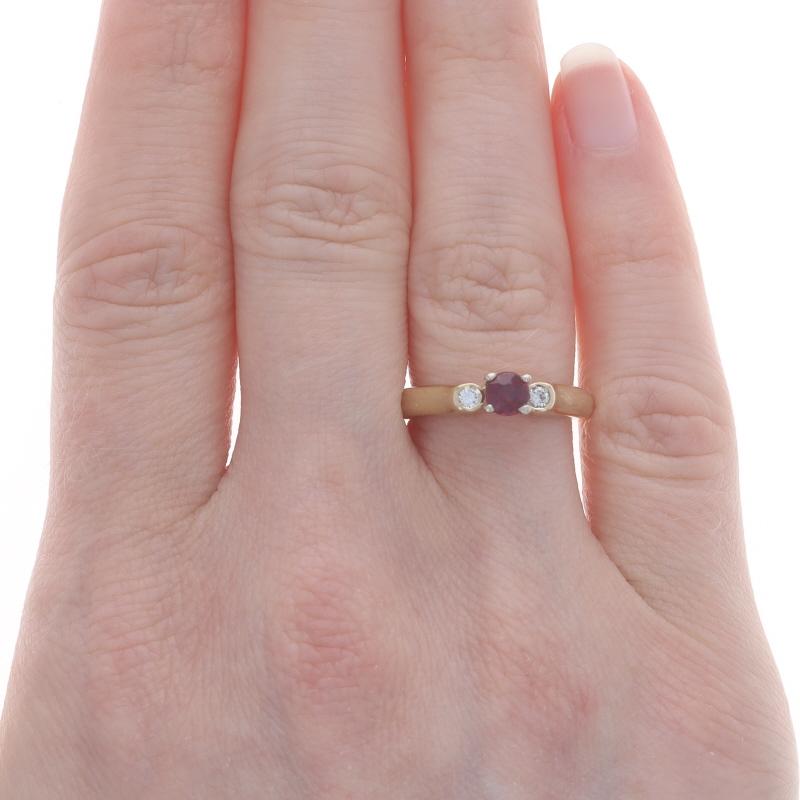 Size: 6 3/4
Sizing Fee: Up 1 1/2 sizes for $30 or Down 1 1/2 sizes for $30

Metal Content: 14k Yellow Gold & 14k White Gold

Stone Information

Natural Rubellite Tourmaline
Carat(s): .31ct
Cut: Round
Color: Pinkish Red

Natural Diamonds
Carat(s):