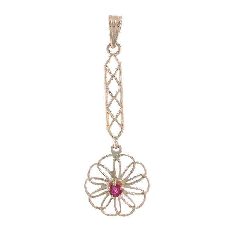 Era: Art Deco
Date: 1920s - 1930s

Metal Content: 14k Yellow Gold

Stone Information

Natural Ruby
Treatment: Heating
Carat(s): .06ct
Cut: Round
Color: Pinkish Red

Style: Lavaliere Solitaire
Theme: Flower

Measurements

Tall (from stationary bail):