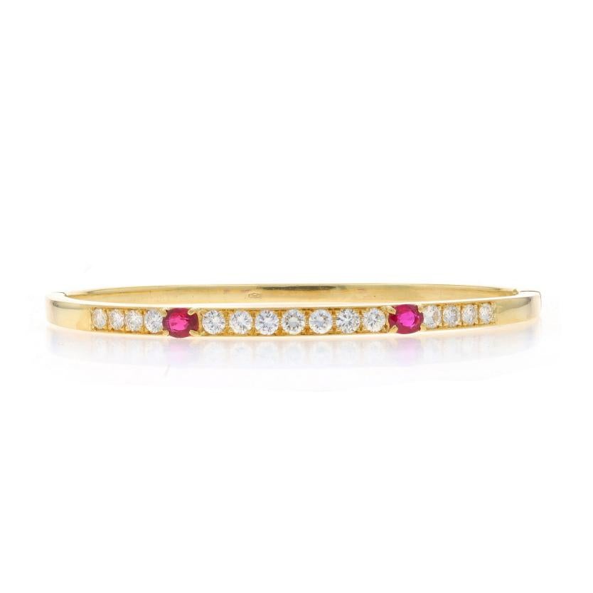 Metal Content: 18k Yellow Gold

Stone Information

Natural Rubies
Treatment: Heating
Carat(s): .90ctw
Cut: Oval
Color: Pinkish Red

Natural Diamonds
Carat(s): 1.43ctw
Cut: Round Brilliant
Color: G - H
Clarity: VS1 - VS2

Total Carats: