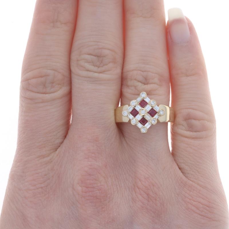 Size: 7

Metal Content: 18k Yellow Gold

Stone Information
Natural Rubies
Treatment: Heating
Carat(s): .53ctw
Cut: Square
Color: Red

Natural Diamonds
Carat(s): .64ctw
Cut: Round Brilliant & Baguette
Color: F - G
Clarity: VS1 - VS2

Total Carats: