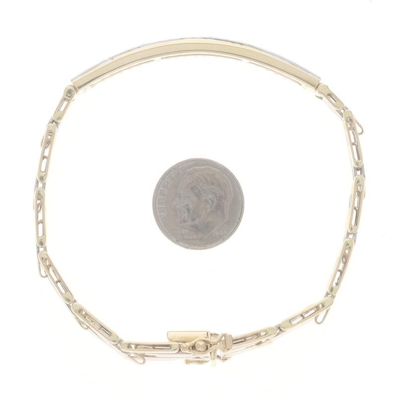 Bracciale a barre curve in oro giallo con diamanti e rubini 7 1/4