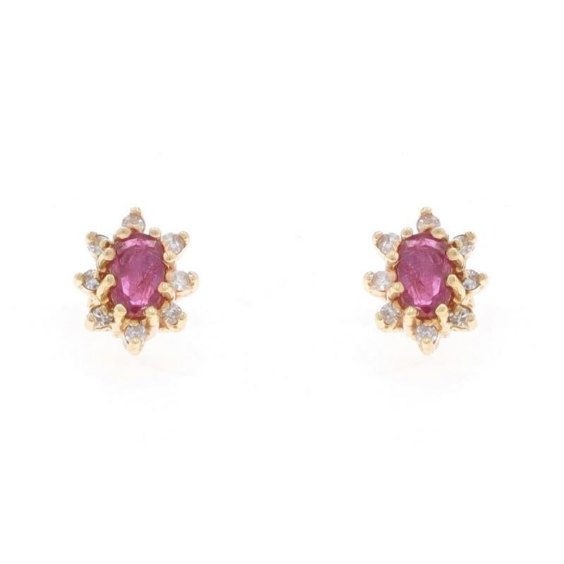 Metal Content: 14k Yellow Gold

Stone Information

Natural Rubies
Treatment: Heating
Carat(s): .70ctw
Cut: Oval
Color: Purplish Red

Natural Diamonds
Carat(s): .10ctw
Cut: Single
Color: G - H
Clarity: SI1 - SI2

Total Carats: .80ctw

Style: Halo