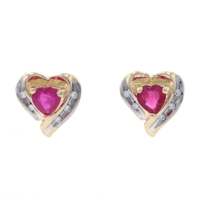 Metal Content: 14k Yellow Gold & 14k White Gold

Stone Information
Natural Rubies
Treatment: Heating
Carat(s): .70ctw
Cut: Heart
Color: Pinkish Red

Natural Diamonds
Carat(s): .05ctw
Cut: Round Brilliant
Color: G
Clarity: SI2 - I1

Total Carats: