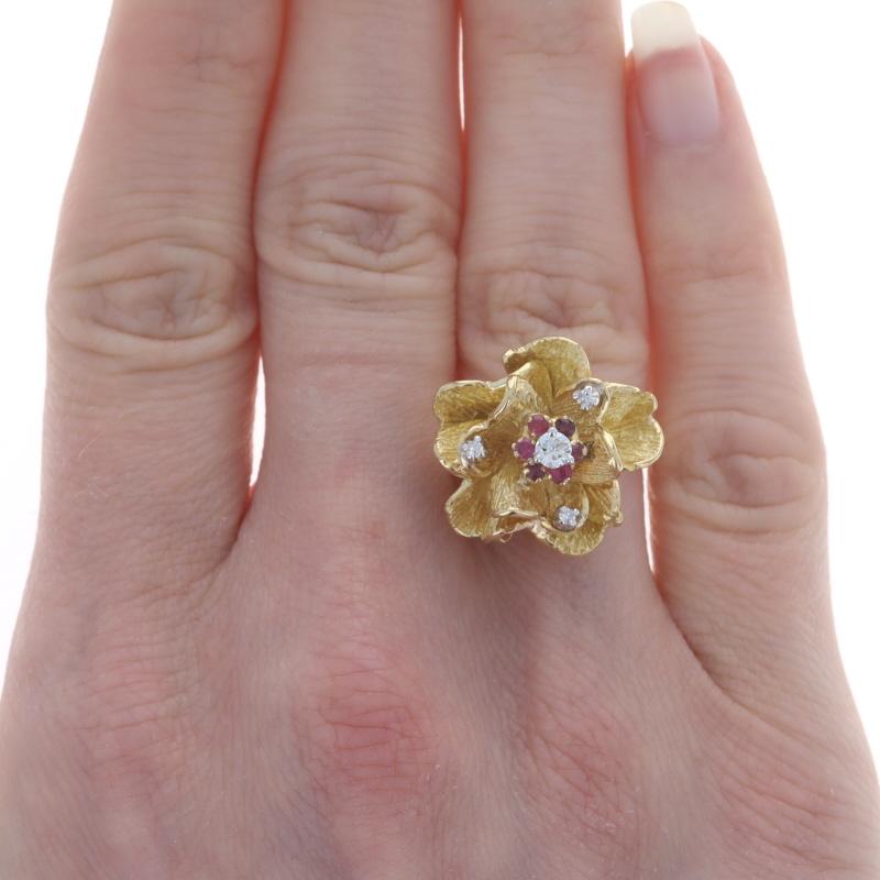 Size: 6 1/2
Sizing Fee: Up 3 sizes for $50 or Down 2 sizes for $35

Era: Vintage

Metal Content: 18k Yellow Gold & 18k White Gold

Stone Information

Natural Rubies
Treatment: Heating
Carat(s): .18ctw
Cut: Round
Color: Pinkish Red

Natural