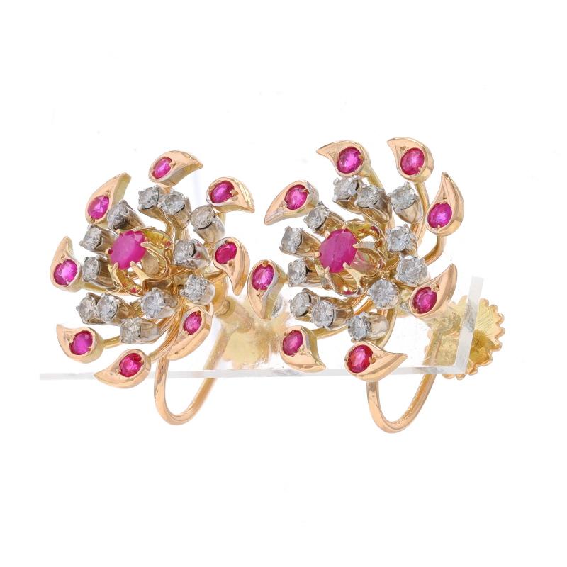 Era: Vintage

Metal Content: 14k Yellow Gold & 14k White Gold

Stone Information
Natural Rubies
Treatment: Heating
Carat(s): 1.35ctw
Cut: Round
Color: Pinkish Red

Natural Diamonds
Carat(s): 1.10ctw
Cut: Round Brilliant
Color: I - J
Clarity: SI2 -