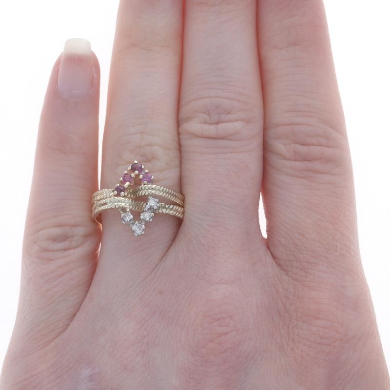 Size: 6 1/2
Sizing Fee: Up 3 sizes for $40 or Down 1 size for $30

Era: Vintage

Metal Content: 14k Yellow Gold & 14k White Gold

Stone Information

Natural Rubies
Treatment: Heating
Carat(s): .32ctw
Cut: Roud
Color: Pinkish Red

Natural