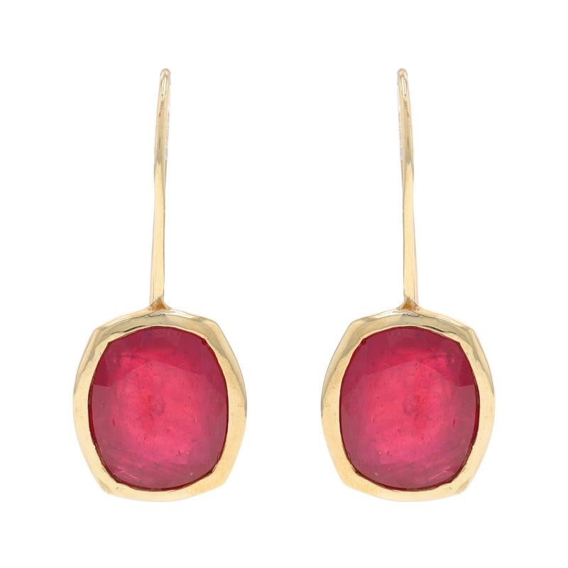 Metal Content: 10k Yellow Gold

Stone Information

Natural Rubies
Treatment: Heated & Lead Glass Filled
Cut: Cushion
Color: Red

Style: Drop
Fastening Type: Fishhook Closures
Features: Bezel Set Stones

Measurements

Tall: 1 1/8