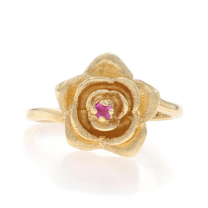 Size: 6
Sizing Fee: Up 2 sizes for $35 or Down 1 size for $35

Metal Content: 10k Yellow Gold

Stone Information

Natural Ruby
Treatment: Heating
Carat(s): .05ct
Cut: Round

Style: Solitaire Bypass
Theme: Flower, Blossom
Features: Etched