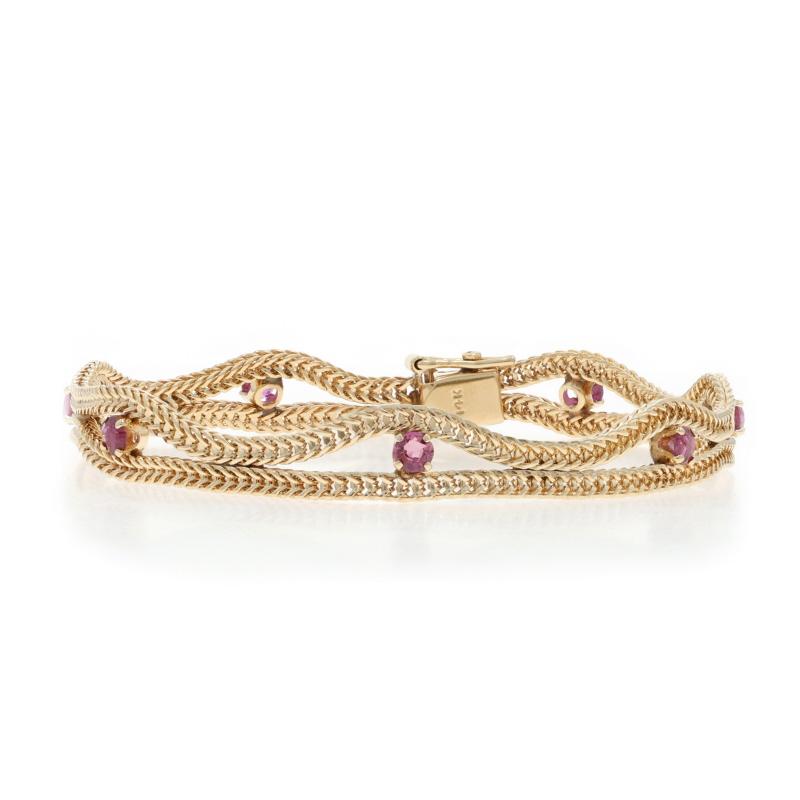 Metal Content: 14k Yellow Gold

Stone Information

Natural Rubies
Treatment: Heating
Carat(s): 1.54ctw
Cut: Round

Total Carats: 1.54ctw

Chain Style: Foxtail
Bracelet Style: Fancy Chain
Fastening Type: Tab Box Clasp with One Side Safety