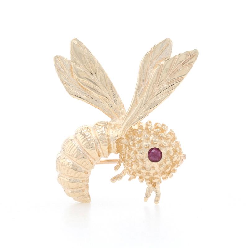 Metal Content: 14k Yellow Gold

Stone Information
Genuine Ruby
Treatment: Heating
Carat: 0.5ct
Cut: Round
Color: Pinkish Red

Style: Brooch 
Fastening Type: Hinged Pin and Whale Tail Bullet Clasp
Theme: Honey Bee, Insect

Measurements
Tall: 1