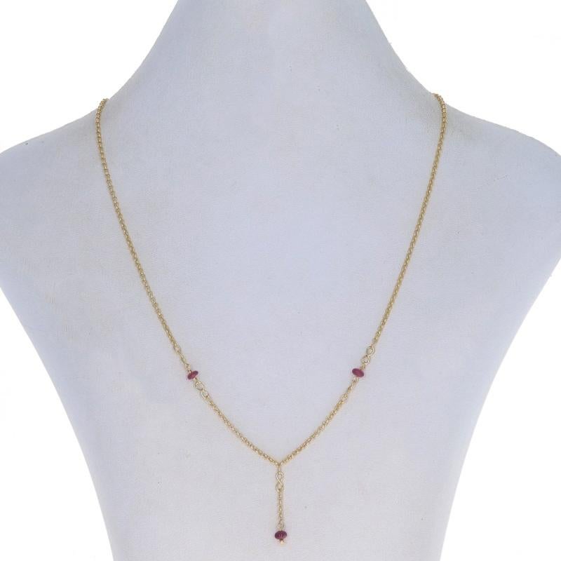 Metal Content: 14k Yellow Gold

Stone Information
Natural Rubies
Treatment: Heating
Cut: Rondelle Bead
Color: Pinkish Red

Style: Lariat Drop
Chain Style: Rolo
Necklace Style: Chain
Fastening Type: Spring Ring Clasp
Theme: Love

Measurements
Length: