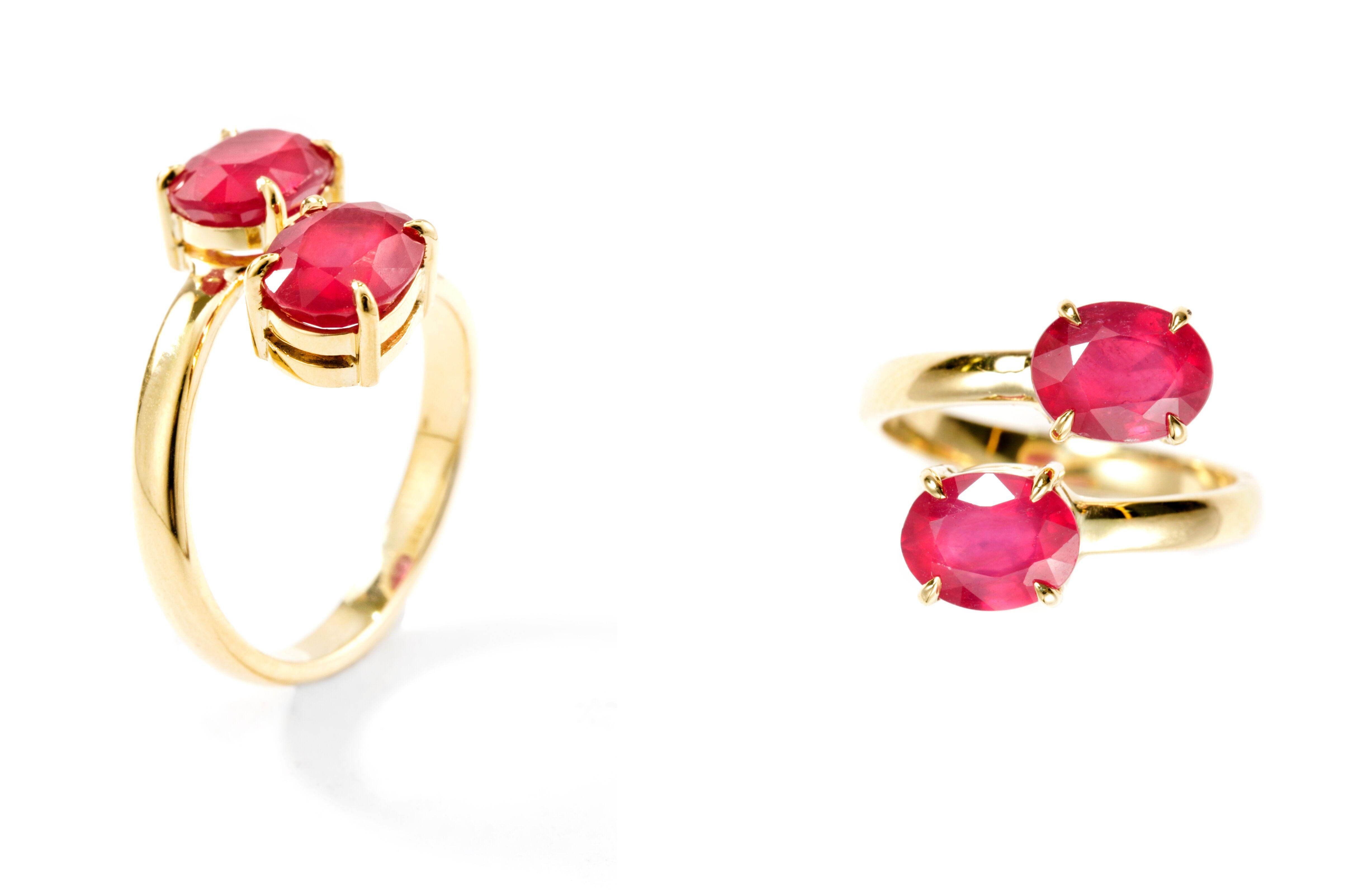 Designed exclusively by Ara Vartanian, this 18 Karat Yellow Gold open-style Ring features a pair of oval faceted 3.9 Carat Rubies.