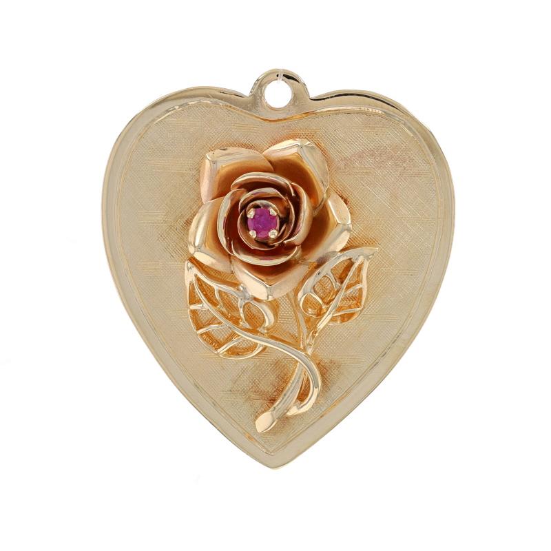 Metal Content: 14k Yellow Gold

Stone Information

Natural Ruby
Treatment: Heating
Carat(s): .06ct
Cut: Round
Color: Pinkish Red

Theme: Rose Blossom Heart, Love Flower
Features: Smooth & Crosshatch Textured Finishes

Measurements

Tall (from