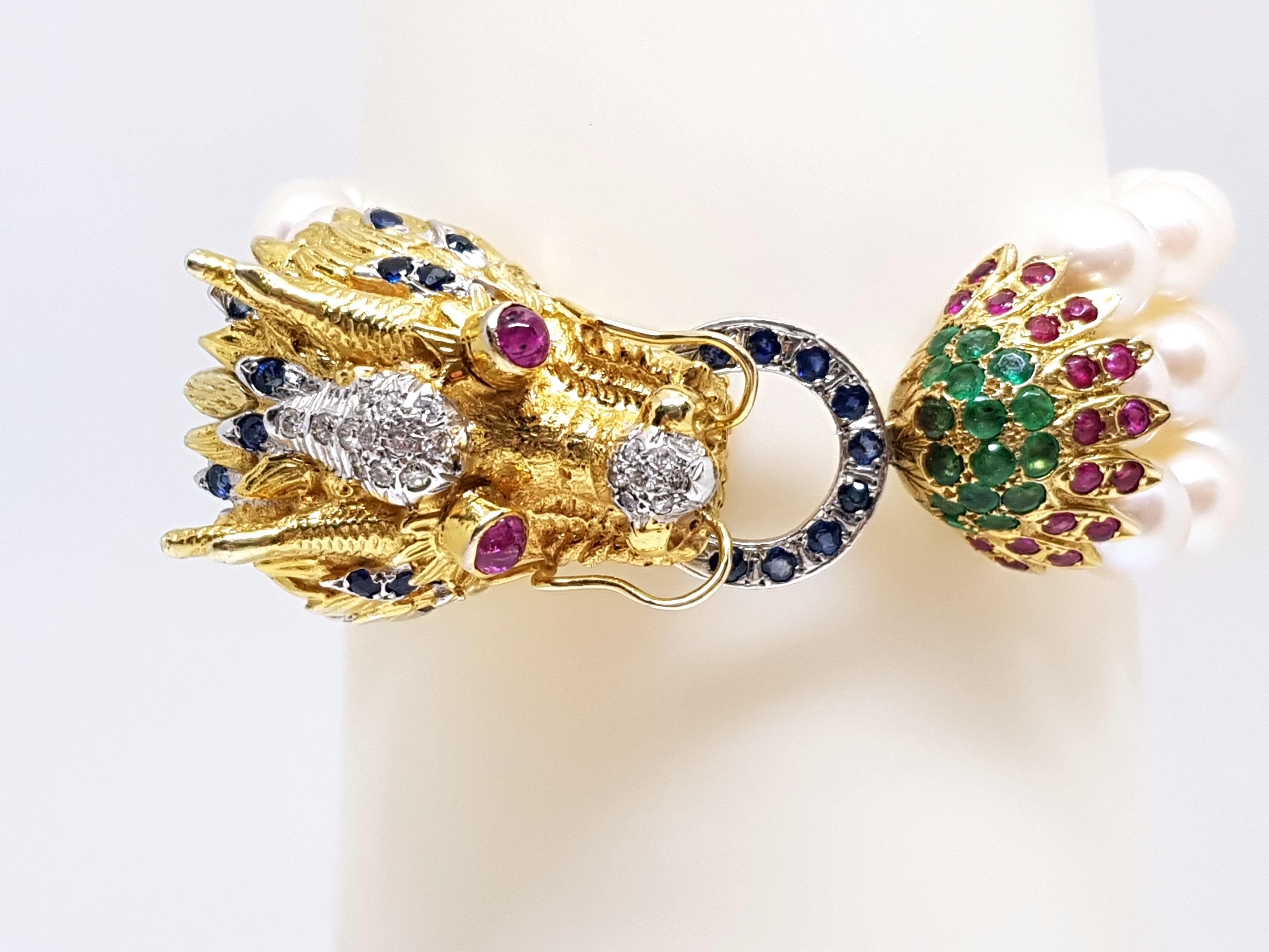 Hand Made Piece
Gold: 14K Yellow Gold. 
Weight: 75.94 gr.
Diamonds: 0.38ct. G / SI1
Sapphires: 1.05ct.
Emeralds: 1.12ct.
Rubies: 1.50ct.
Pearls: Akoya White Pearls 3 Strands
Length: 19.0 cm Free Lengthening op bracelet up to 25cm
Width: 2.3 - 2.7 cm