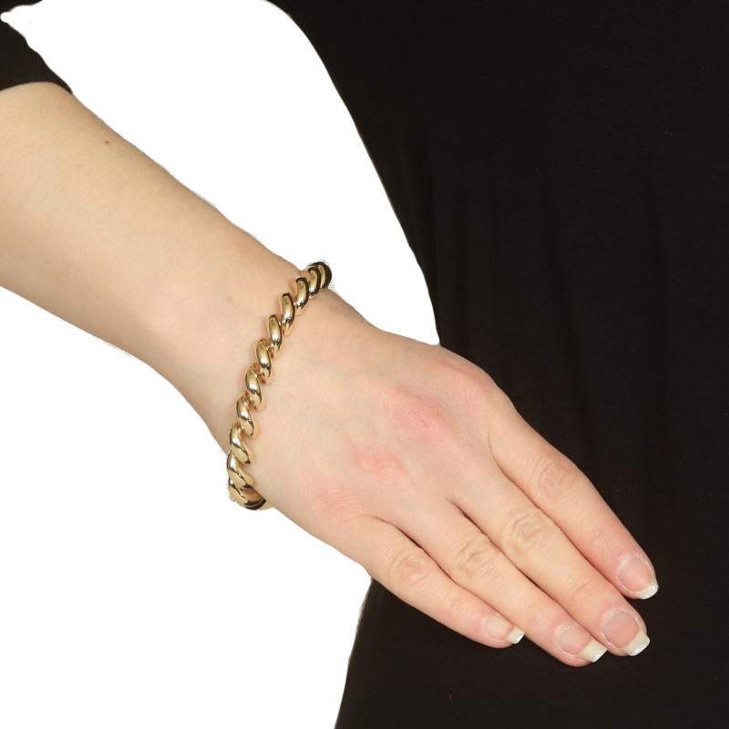 Metal Content: 14k Yellow Gold

Chain Style: San Marco
Bracelet Style: Chain
Fastening Type: Tab Box Clasp with One Side Safety Clasp

Measurements

Length: 8