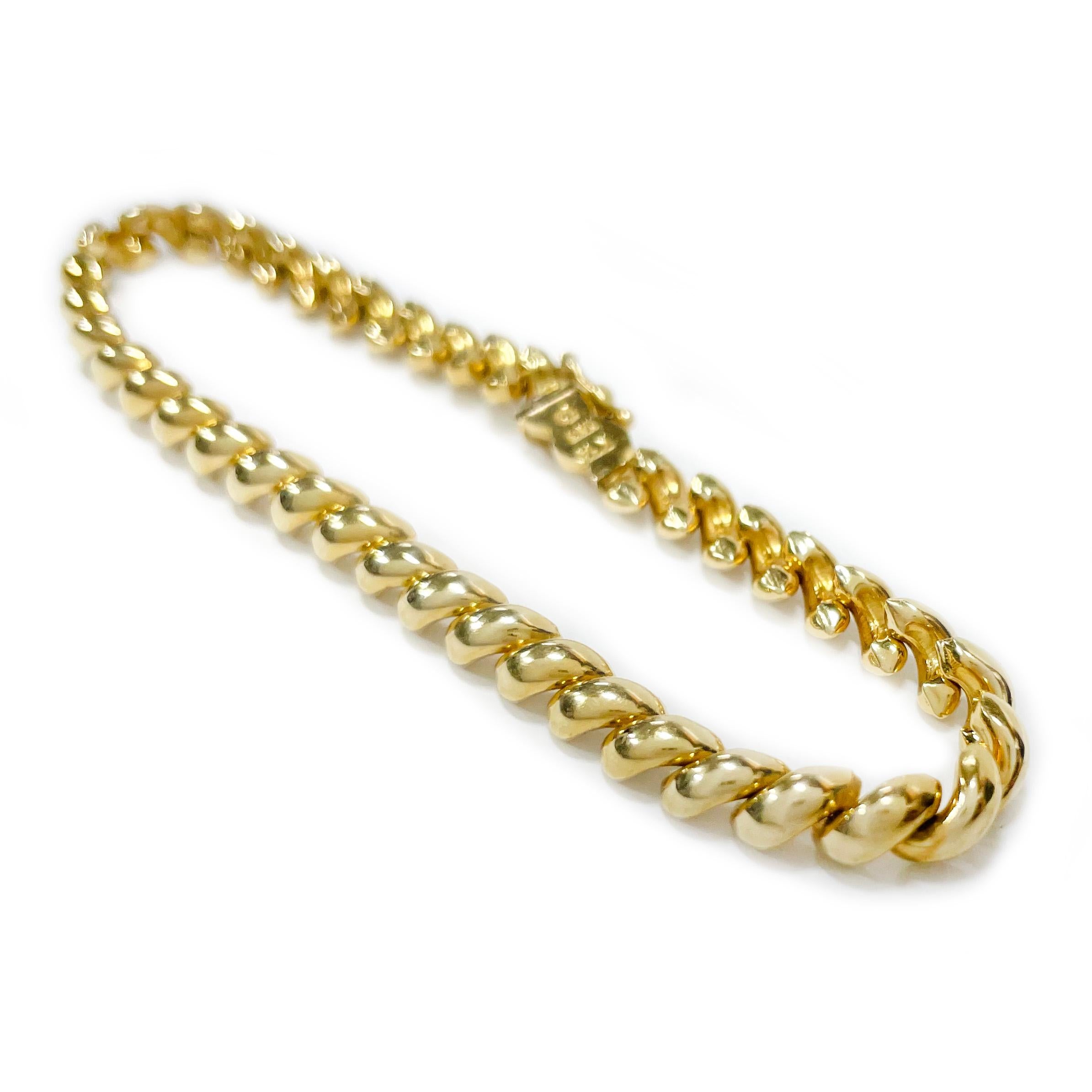 14 Karat Yellow Gold San Marco Link Bracelet. The bracelet features 4.5mm x 2.5mm smooth shiny links. The bracelet is 7