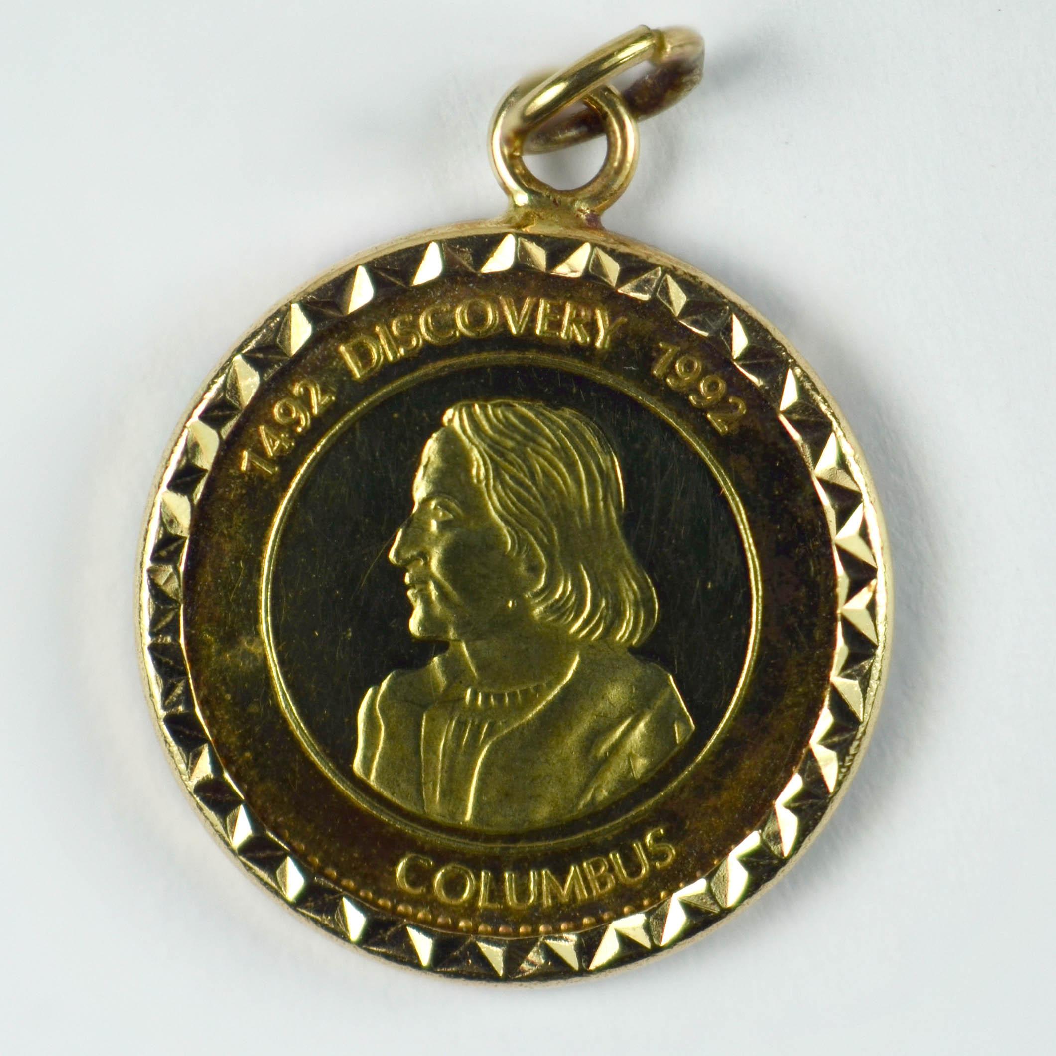 A 24 karat gold coin held in a facetted 14 karat yellow gold frame commemorating 500 years since Christopher Columbus made the discovery of America on the boat Santa Maria. Dated 1492 - 1992.

Dimensions: 2 x 1.5 x 0.2 cm
Weight: 1.90 grams