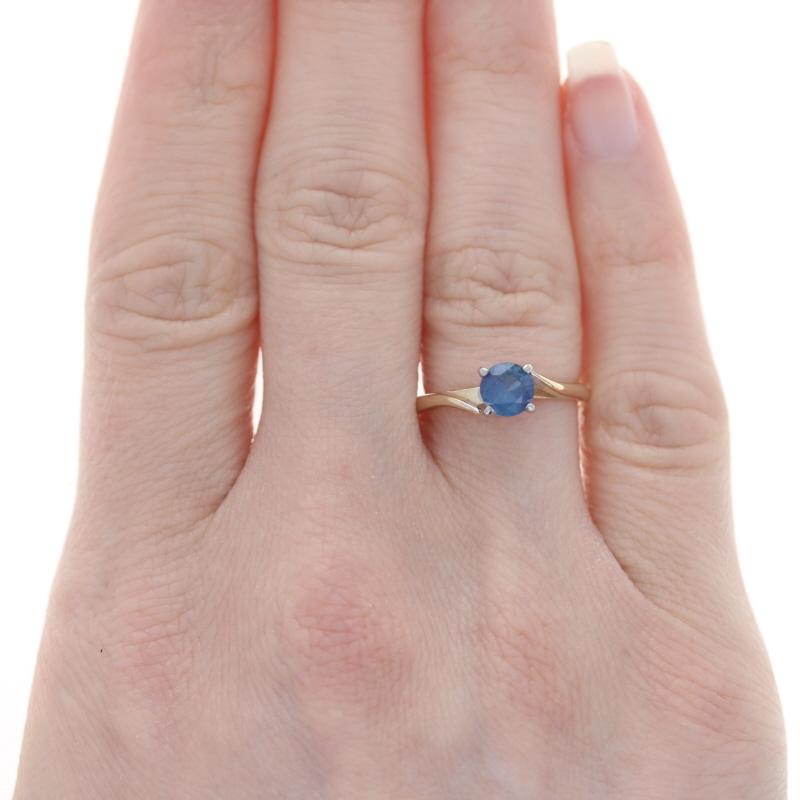 Size: 6 1/2
Sizing Fee: Down 3 for $30 or up 2 for $35

Metal Content: 14k Yellow Gold & 14k White Gold

Stone Information

Natural Sapphire
Treatment: Heating
Carat(s): .73ct
Cut: Round
Color: Blue

Total Carats: .73ct

Style: Bypass,