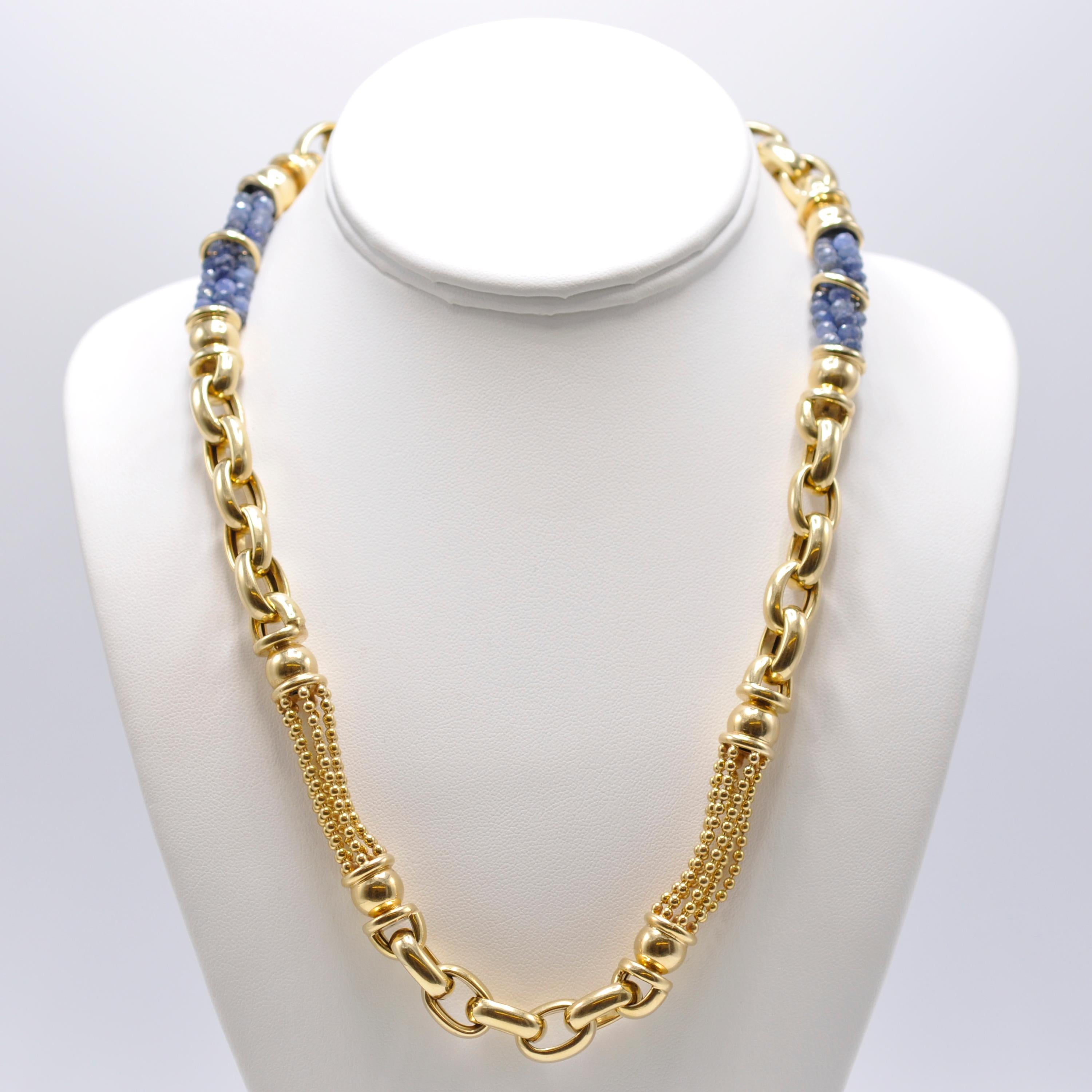 This strong 14 Karat yellow gold chain link necklace is accented with 2 large stations of 40 sapphires each. 

Wear it with your business suits for that extra boost of confidence. 

Stamped 