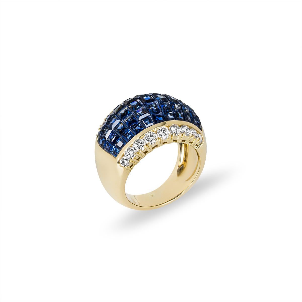 A unique 18k yellow gold sapphire and diamond dress ring. The bombe ring has a domed design set to the centre with 5 rows of invisibly set square-cut sapphires. The 55 sapphires have an approximate total weight of 5.00ct and display a rich blue hue.