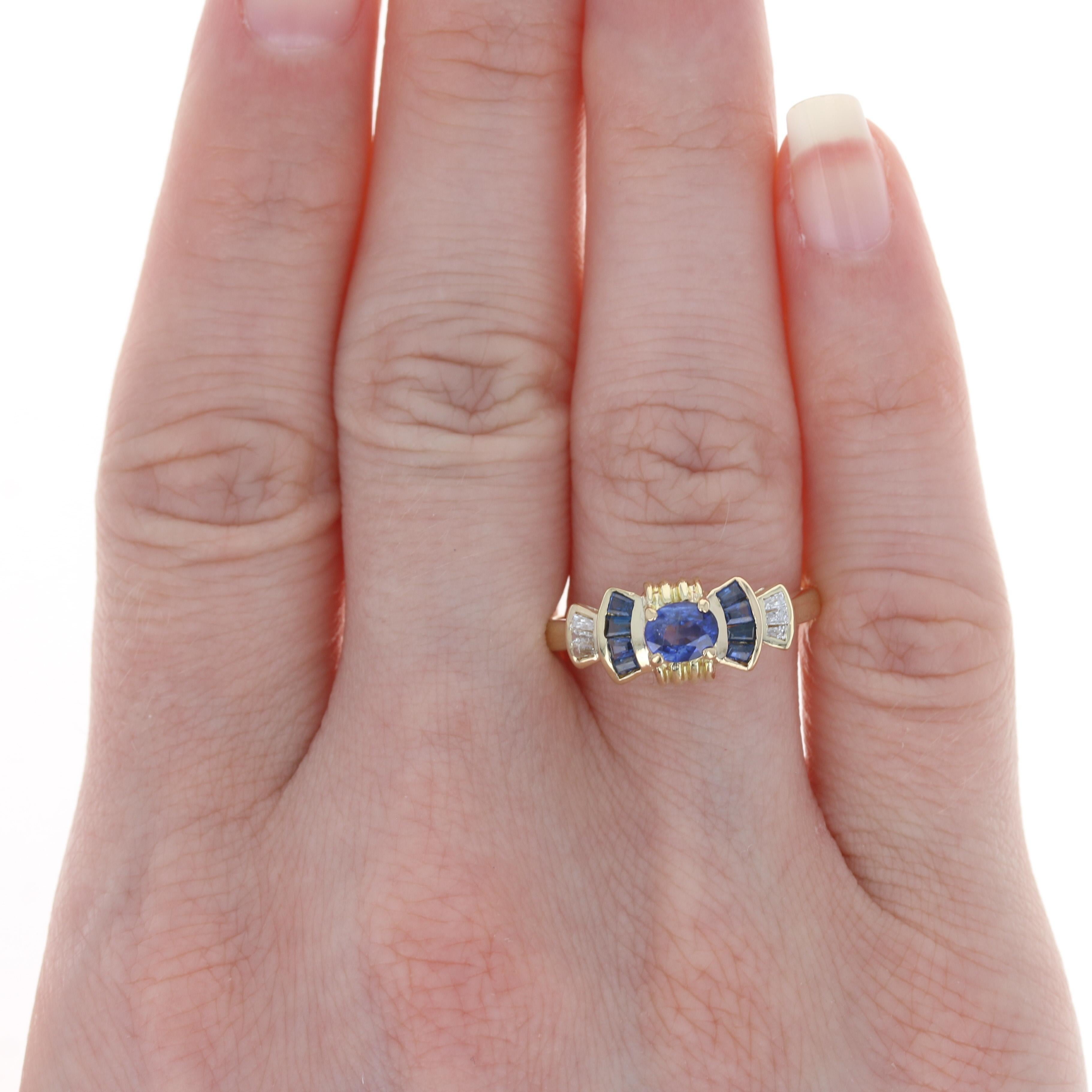 Size: 8 1/4 
 Sizing Fee: Up 2 sizes or Down 1 size for $30 
 
 Metal Content: 18k Yellow Gold 
 
 Stone Information: 
 Genuine Sapphires
 Treatment: Heating 
 Carats: .85ctw 
 Cuts: Oval & Tapered Baguette 
 Color: Blue 
 Solitaire's Size: 5.2mm x